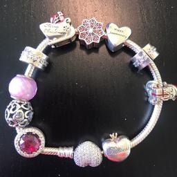 Includes all charms. Excellent condition