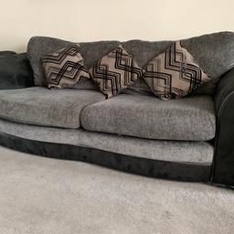 3 piece settee, it’s soft chenille upholstery in contemporary grey is contrasted by a chic black to the fascia and stylishly curved arms. Intact with all fire labels. It was originally made to order from a small Furniture company.Well maintained and clean. From a smoke free home. Buyer to collect. Cash on collection. 
