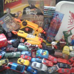 Lots of cars scooby doo and batman cups slide hockey need guns x2 with foam bullets nerf guns shields foam bullets sunglasses wrestling dvds little characters Mario etc have a few other things that need batteries cars and laser things and dinosaur that walks have other things that can be added kite etc