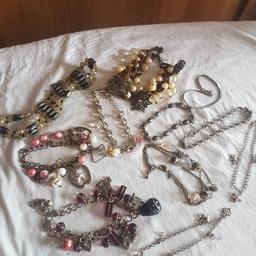 Assortment of different charm bracelets in good condition.
