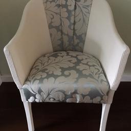A lovely Lloyd loom style chair which has been Upcycled with duck egg and silver fabric.Painted in antique white with a unique design on the back.Collection in person only.