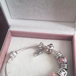 Pandora Bracelet with 10 Charms including, a K, Butterfly, Breast Cancer, Horseshoe, Heart, 2 x glass etc. Very good condition, Original & all stamped