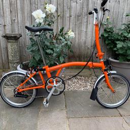 As new Brompton bike for sale. Includes wheeled carry case for ease of transport