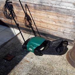 electric lawn rake/scarifier. 300mm raking width. includes grass collection box and instructions. only used once. excellent condition.