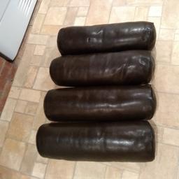4 x leather brown bolster cushions.