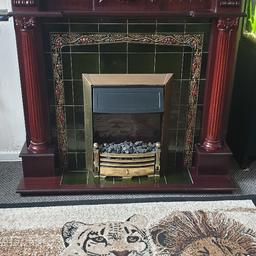 Complete mahogany electric fire place, with two fan heater settings all in excellent working order.