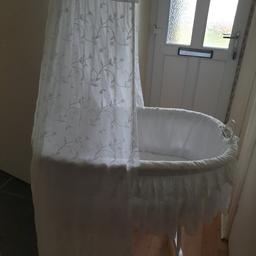 Beautiful moses basket, white canopy & covering. 
On wheels.

Sad sale, we have nowhere to store it.

From smoke free, pet free home.

Collection from TF1 large boot required