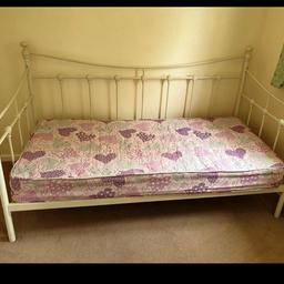 Cream metal single day Bed with mattress. In good condition. Can deliver locally for locally for fuel cost