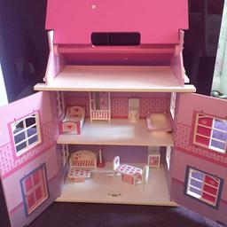 Little girls dollhouse colour pink with all the furniture