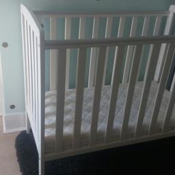 In perfect condition, no marks or stains. Compact smaller sized cot bed with mattress and teething rail (which is untouched) 
Three adjustable heights and removable side. 
Suitable from birth.

Height: 91cm 
Width: 124.2cm
Depth: 65cm