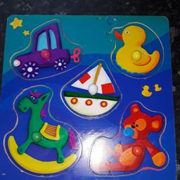 wooden puzzle
5 pieces
with small round knobs to hold to help put in and out.
lovely colourful patterns
used but in great condition