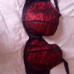 almost new red with black lace design..44dd.
