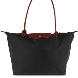 Longchamp Le Pliage Tote Bag - Large. New! Never used. 12.2 x 11.8 x 7.5” Polyamide canvas with inside coating. Zipped and snap closure. Black with brown leather. This tote bag captivates you with its minimalist silhouette and ample volume which can easily hold all of your documents or a laptop. Its long handles allow you to wear it comfortably on your shoulder, while its zipper closure ensures the safety of all of your belongings. It can even be folded into the size of a book. Cash or delivery!