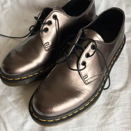 Dr Martens silver coloured shoes in size 5. Excellent quality worn twice. Postage paid by buyer.