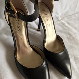 Guess Leather Black High Heels with ankle strap. Size 7.5. Worn twice. See photo of heel shows wear. Been in bottom of wardrobe for too long and time to move on. Buyer pays postage.