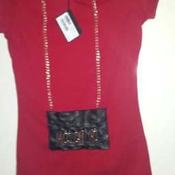 Brand new .with price tag on it .gold metal chain and lettering hanging on it
size small