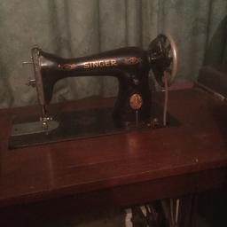 A 15K80 Singer Sewing Machine in fair condition. It includes the instruction manual. For collection only