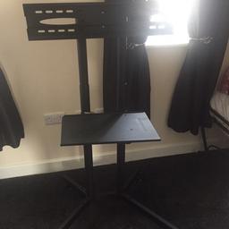 Black heavy duty tv stand with shelve for game Console as lockable castor wheels is an easy move and olds up to about 60 inch TV pick up only this was £70 new not even 12 m old 