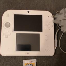 white Nintendo 2ds with super Mario Bros 2 an original charger. great condition 2 slight marks on edges see photos no SD card tho