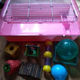 Hamster pink cage in clean good condition with toys including hamster ball.

Cage is approx 2ft long, 18 inches wide and 13 inches high.