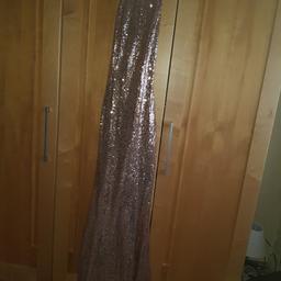 Beautiful Quiz long dress. Still on quiz website for £99 Warn once. My daughter is 5ft3" so it has been just tacked up at the front but can be turned down easily if needed. She wore it with small heels and it was perfect.