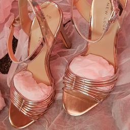 Brand new never been worn  
Rose gold high heeled Sandals
size 4 
price on label £29.99