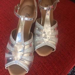Silver sparkly NEW dance shoes size 6, heels 1 1/2 to 2 inch heels, pick up preferred but would post extra fee applies