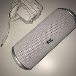 jbl flip original in white. Worked perfectly. Missing casing on the right side. Comes with charger.
