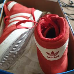 red addidas trainers
never been worn 
size 10