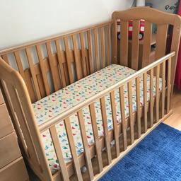 Good condition. Sturdy cot bed. Base moves up/down with age. Sides detach to create the bed.