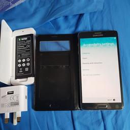 Samsung Galaxy Note 4 mobile phone. used but good condition. comes with case spare battery and chargers .