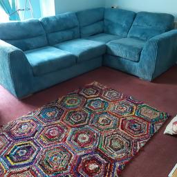 Lovely comfortable sofa. Lovely, vibrant colour, which is best shown in first photo, although it's much nicer in real life. In very good condition, apart from one of seat cover zips is broken - can easily be mended. Covers are removable & washable. Splits into two parts.