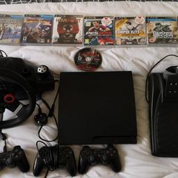 PS3 with 1 official wireless controller.

(All of the other things in the pictures have been sold, so it's only the console with the controller and a few of the games.