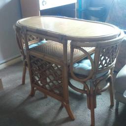 small oval table with two chairs 
bamboo