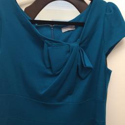 Turquoise ladies dress, excellent condition, size 16. Would prefer pick up but will post for extra postage fee