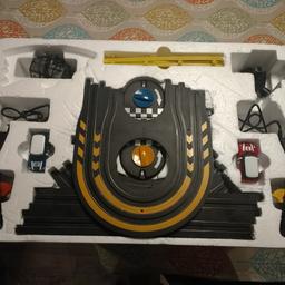 racing track with two mini coopers lots of fun used few times been in storage. like new.