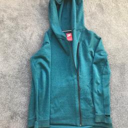 Never been worn, very soft and cosy, is quite long and has a big hood