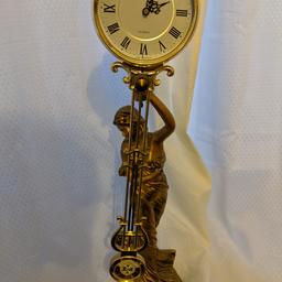 Gold antique style clock like new, woman and child holding pendulum clock. £20 ONO, collection only.