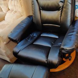 Easy black leather chair + footstool - Chair is in excellent condition, reclines and swivels. Pop in for more information or to view.