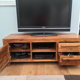 Solid wood entertainment unit big enough to hold 55inch television. Two shelves for sky box etc with wire holes in the back. One cupboard on left and two drawers on right (one drawer sticks slightly). Superb condition and lovely piece of furniture.
Height 50cm, Depth 46cm, Width 135cm
****Collection only - Heavy item****
