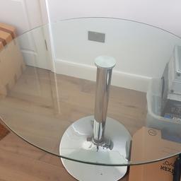 Glass dining table with silver base.
Comfortably sits 4 ppl. 

Height: 75cm 
Diameter: 100cm

Corner is chipped, please refer to pictures.

Collection only.