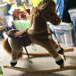 Plush rocking horse in excellent used condition. Padded saddle, wooden handles and base. Collection from smoke and pet free home, Studley.
