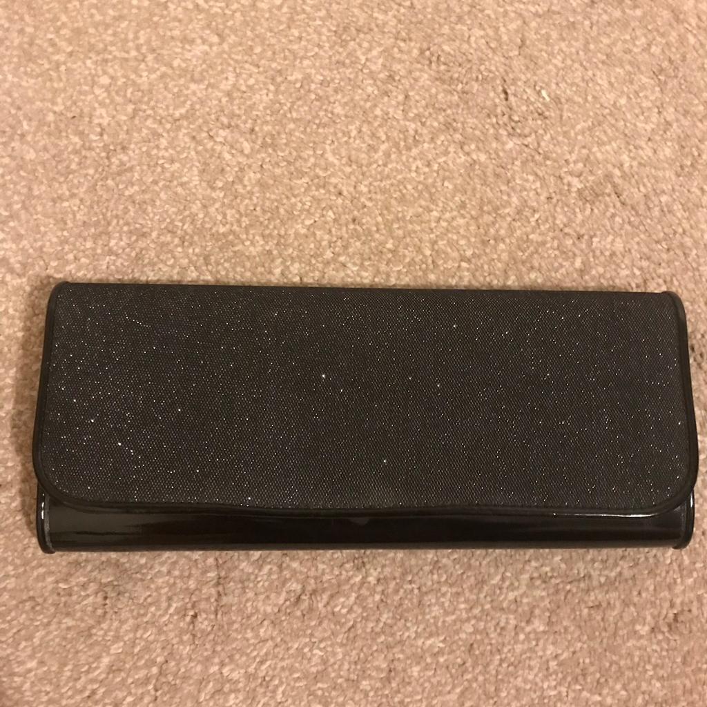 Black clutch bag from Aldo. In excellent condition, used only once.