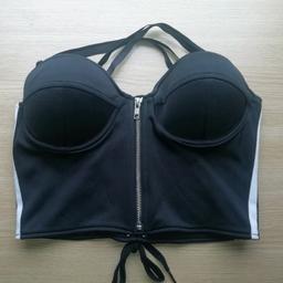 This is a genuine Adidas JEREMY SCOTT BUSTIER top. I have never seen another one like it anywhere, ever!!! It is black with the trademark 3 white tripes down each side, has adjustable cross the back straps, a zip up front and a lace up back with cuped boobs. It is a size 38 - UK 10-12. rrp £175 so grab yourself a one off bargain...