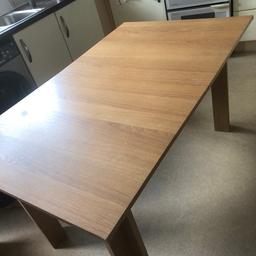Dining table in good condition, heavy and is extendable.