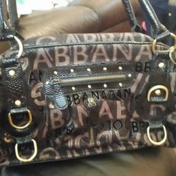 lovely bag has its original charms and it's in great condition has a few little splits staring at the bottom of the straps but easily fixed not noticeable unless your really looking open to offers .