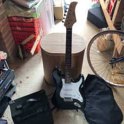 Comes with amp, gig bag, strap and cable
