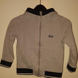 Hugo Boss Boys Hooded Tracksuit Grey Top Age 5. Good condition. Collection only - postage is an additional cost chargeable to buyer.