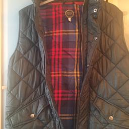Green gillet with check detail inside