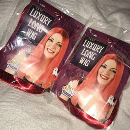 2 long red wigs, unopened